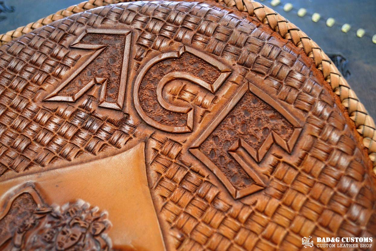 "ACE Pin-Up Girl" design hand tooled and braided on a chopper solo seat. Veg tan leather with kangaroo lace.