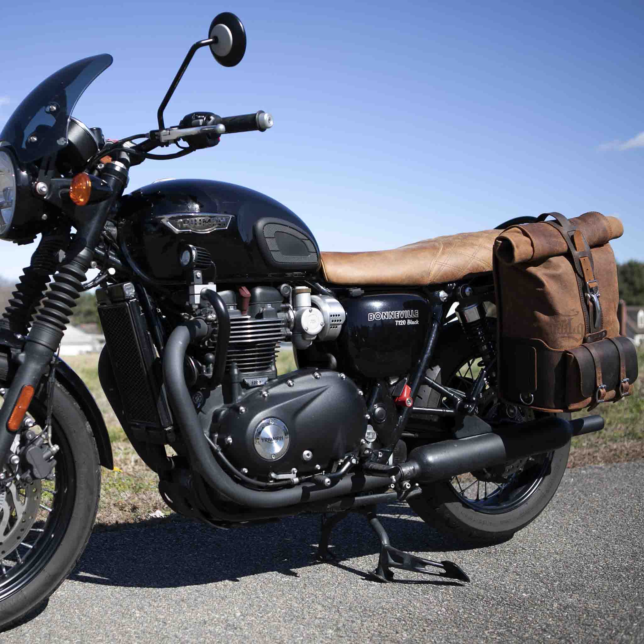 Upgrade your ride with the URB01 Rolltop Backpack Saddlebag. Unique design enables quick conversion from saddlebag to backpack. Hand crafted in USA with premium veg tan water buffalo leather and stainless steel hardware. Durable and stylish, it's the perfect fit for your motorcycle.